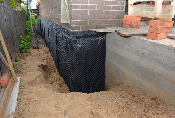 Happy homeowners after waterproofing job in Bedminster